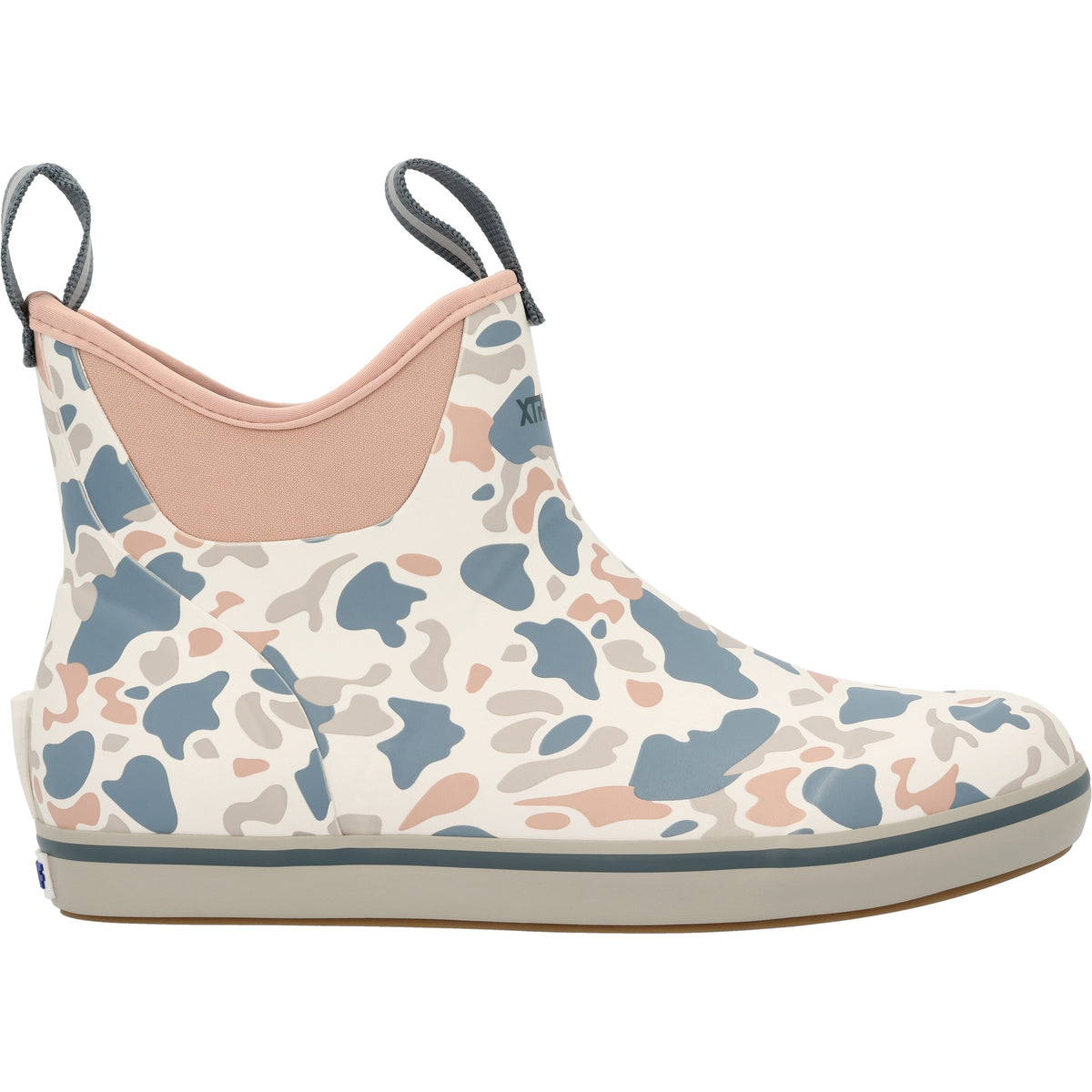 Side profile of the XtraTuf Women's Ankle Deck Boot in ivory duck camo showing the ankle-height shaft and rear pull loop.