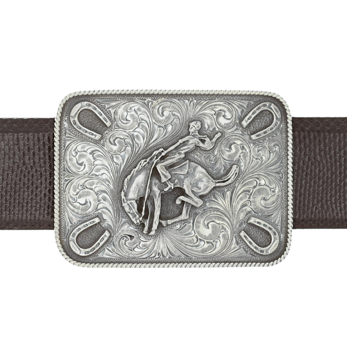 Clint Orms Dimmit 1802 sterling silver trophy buckle with a bronc rider and hand-engraved scrollwork, on a brown belt