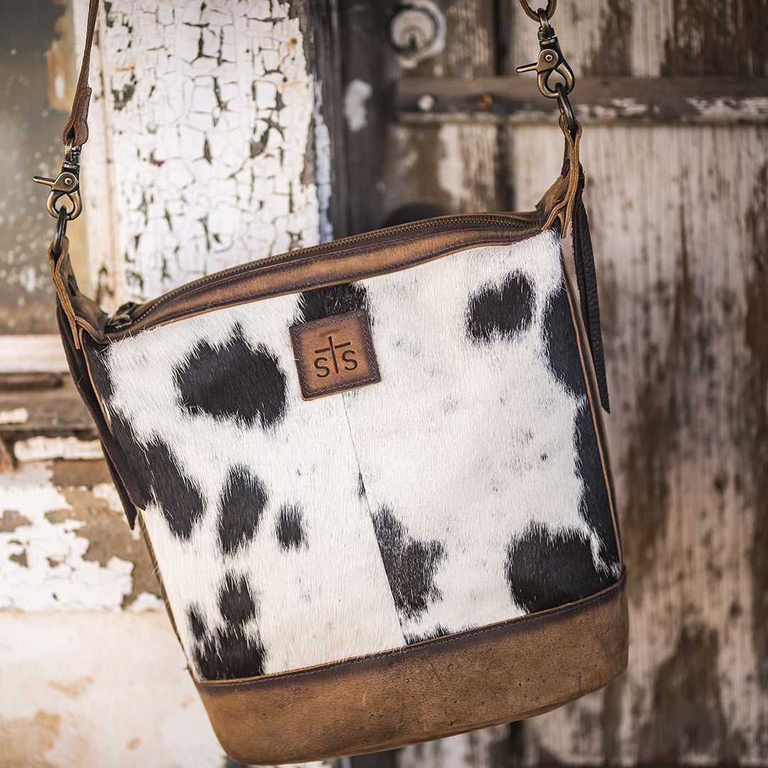 STS Ranchwear Women's Cowhide Mail Bag Crossbody, Black and White Hair-On – lifestyle, hanging from strap