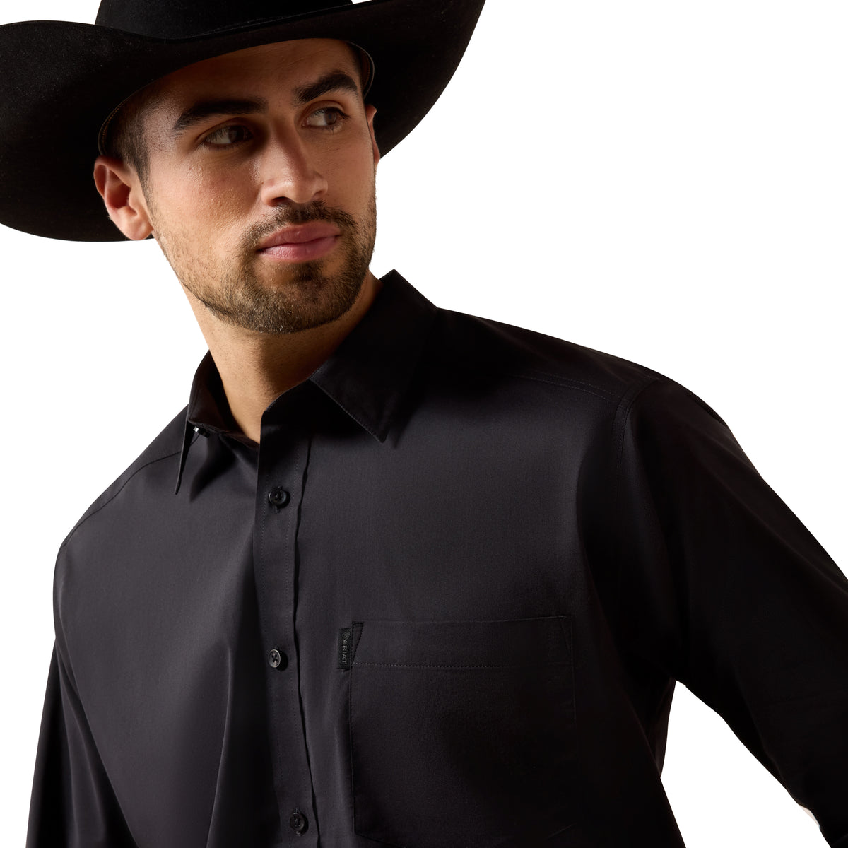 Black Ariat men's Everything Classic Fit shirt with long sleeves and button-down front, displayed on a hanger.