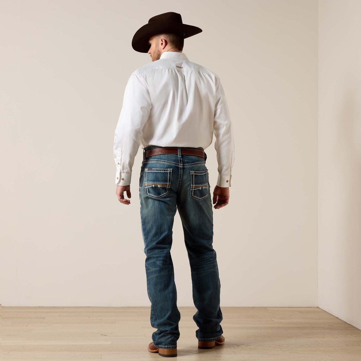 Ariat men's M4 Coltrane boot cut jeans in Durango wash, casual denim with classic fit and sturdy construction.