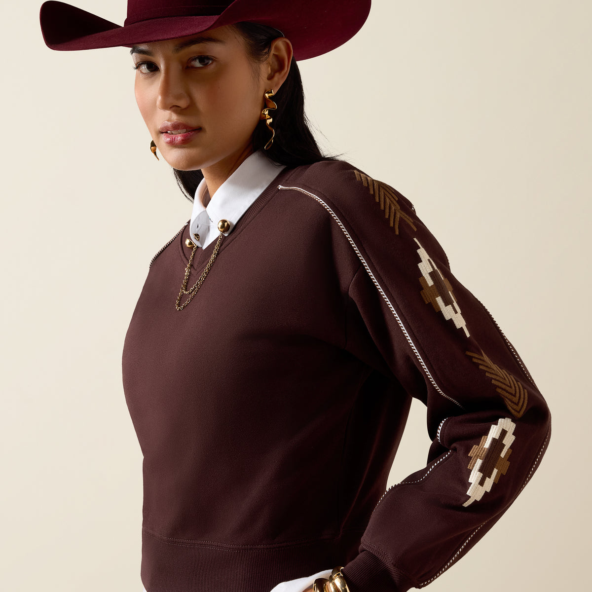 Ariat Women's Dakota Sweatshirt in chocolate plum, soft fleece fabric, with a relaxed fit and ribbed cuffs and hem.