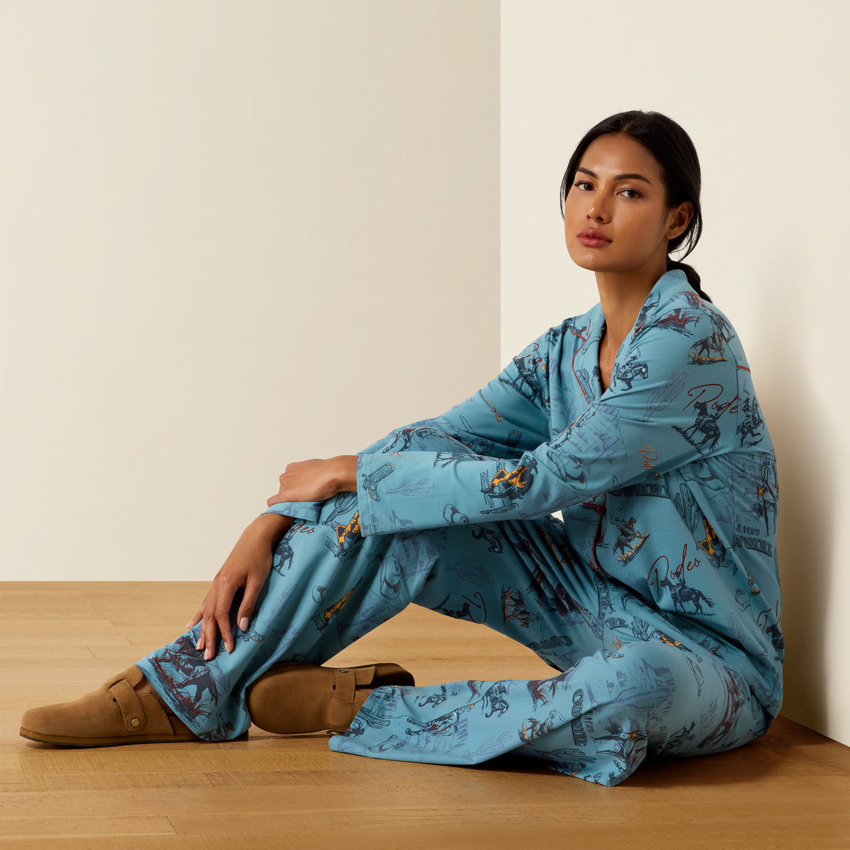 Ariat Women's Dreams Pajama Set with retro rodeo print, featuring long sleeve top and matching pants, soft and comfortable for sleep.