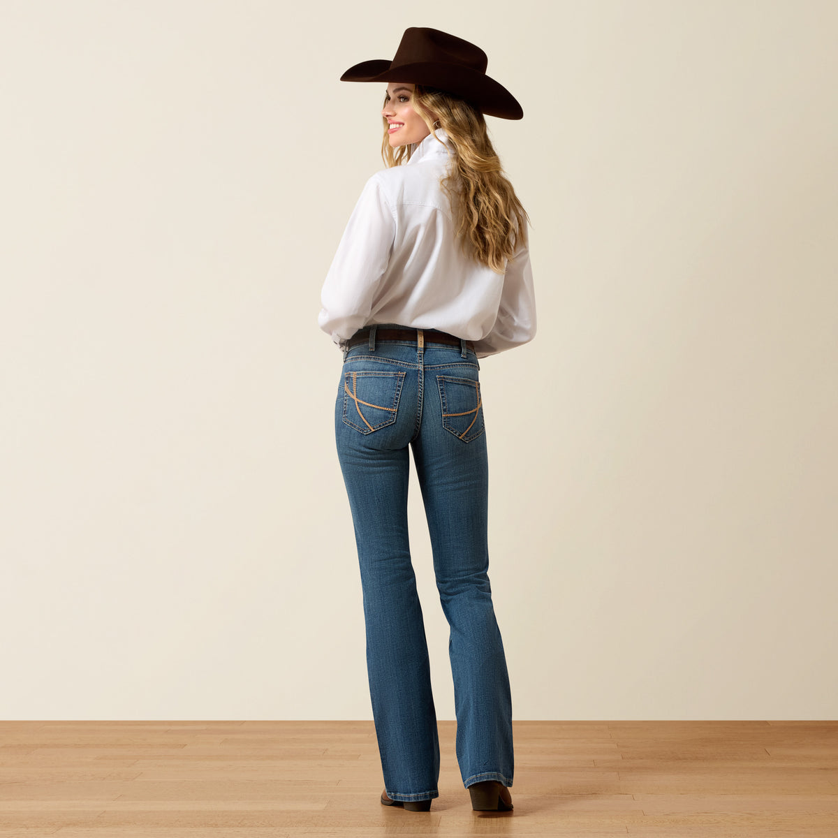 Ariat Women's Perfect Rise Maggie Boot Cut Jeans in Redonda color, showing the classic fit and denim fabric with a slight flare.