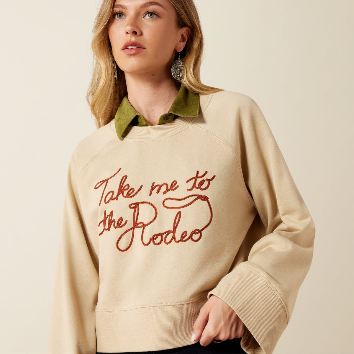 Ariat Women's Sydney Sweatshirt in Irish Cream, cozy knit material, long sleeves, and relaxed fit, perfect for casual wear.