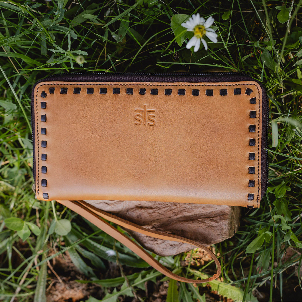 Tan Berkley bifold wallet by STS Ranchwear with leather finish and classic design, shown open to display card slots and cash compartment.