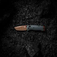 Benchmade Bailout Knife in Taiga Green with Tanto blade, showcasing its compact folding design and textured handle.