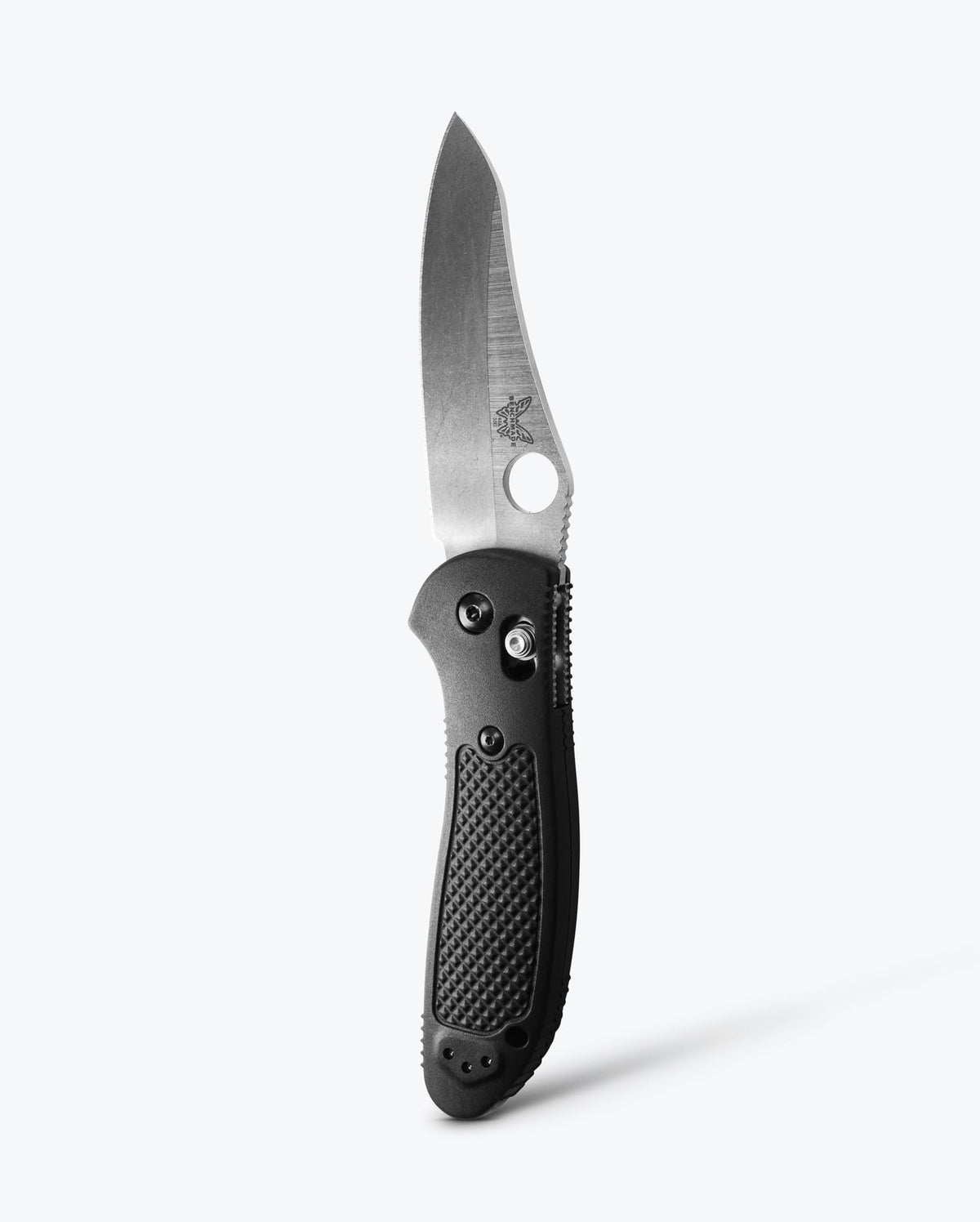 Benchmade Griptilian knife with black Grivory handle and sheepsfoot blade, showcasing its sleek design and durable construction.