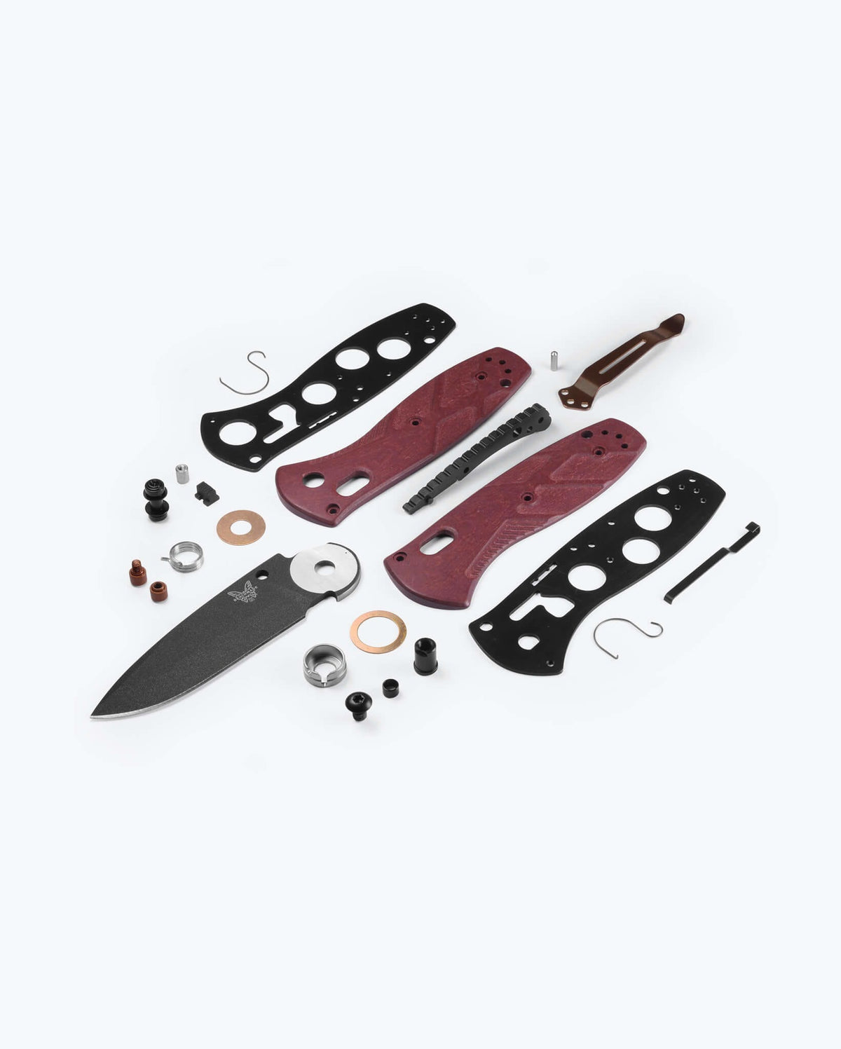 Benchmade Mini Barrage knife with redstone handle and drop-point blade, showcasing its compact, tactical design.