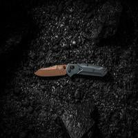 Benchmade Osborne knife with Taiga Green handle and reverse tanto blade, showcasing its sleek design and high-quality craftsmanship.