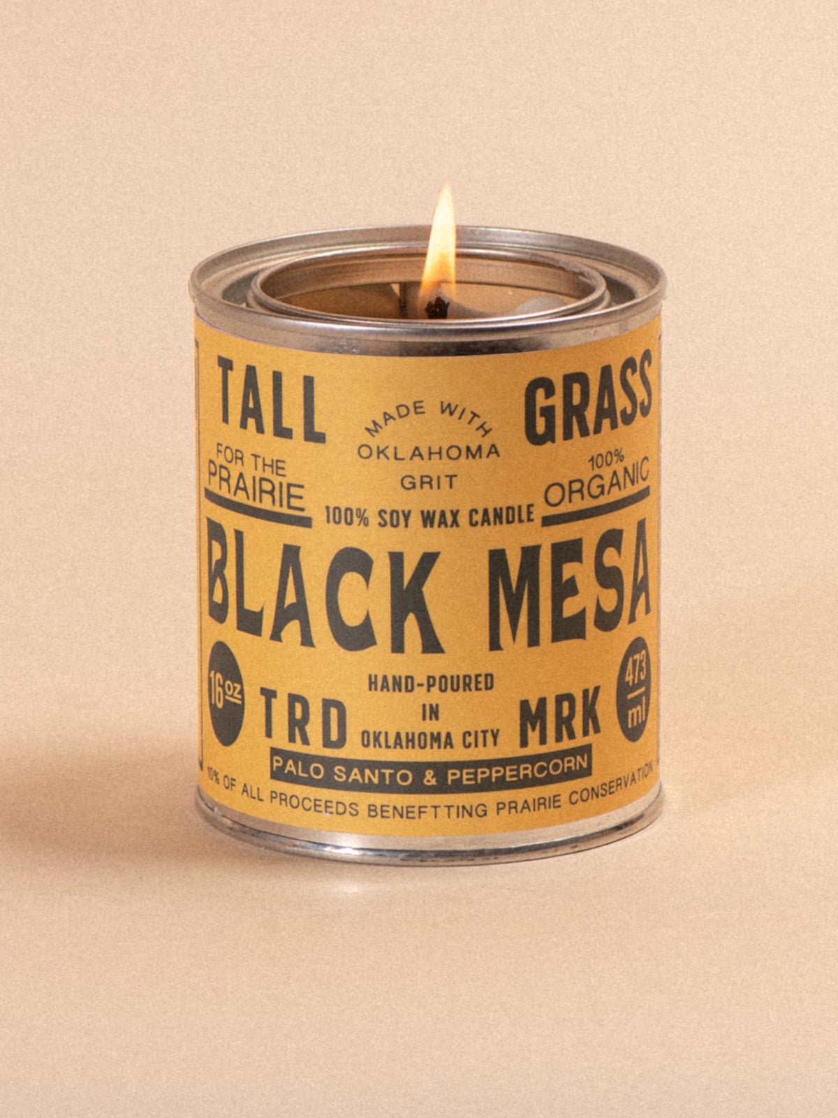 Tallgrass Supply Black Mesa Palo Santo and Peppercorn soy wax candle with a black container and wooden lid, elegant candle design