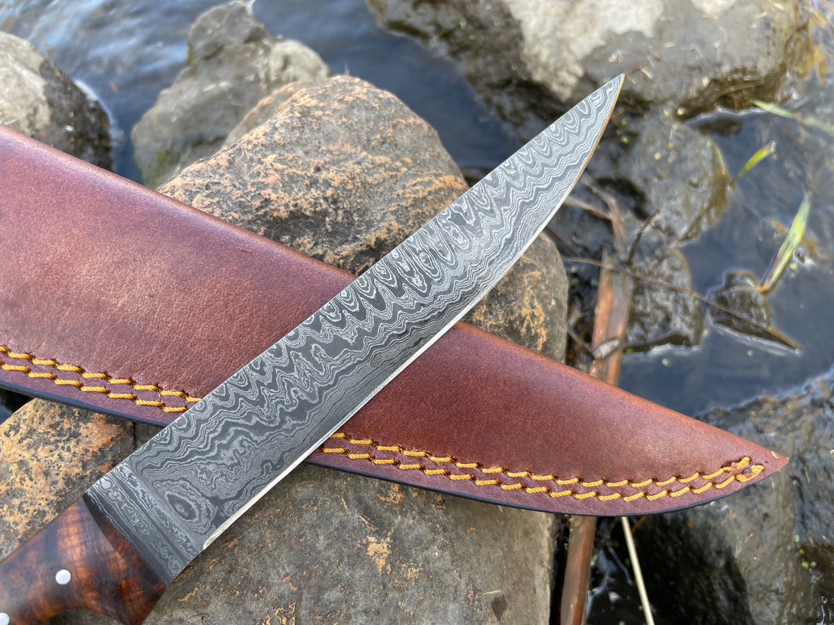 Titan International K boning and flaying knife with high-carbon Ladder Damascus blade, ideal for precise butchering tasks.