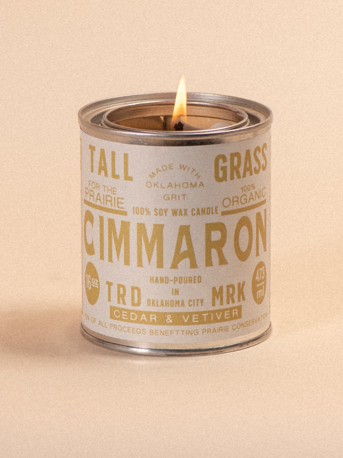 Tallgrass Supply Cimmaron cedar and vetiver soy wax candle with a natural wooden wick in a glass jar.