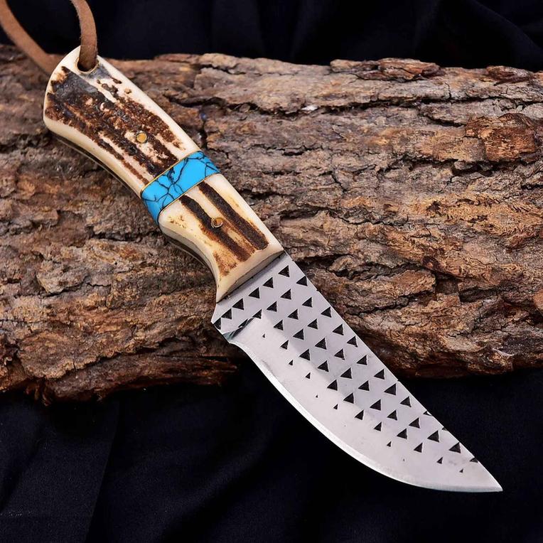 Malika Knives cowboy knife with D2 steel blade, 5mm thick, and antler turquoise handle, featuring a simple design.