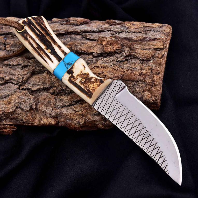 Malika Knives cowboy knife with D2 steel blade, 5mm thick, featuring an antler turquoise handle and simple design.