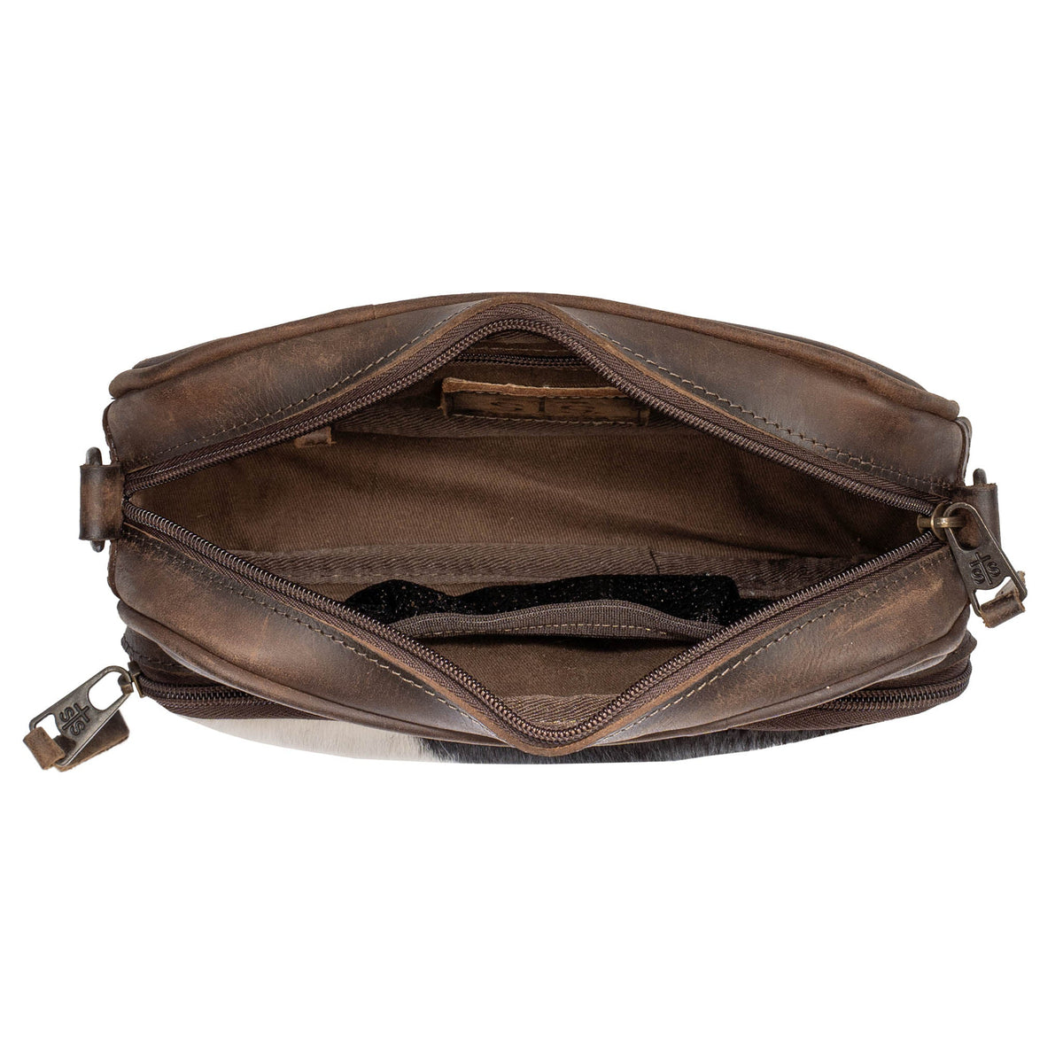 STS Ranchwear Cowhide Jess Crossbody bag featuring a rugged cowhide pattern and adjustable strap for everyday style.