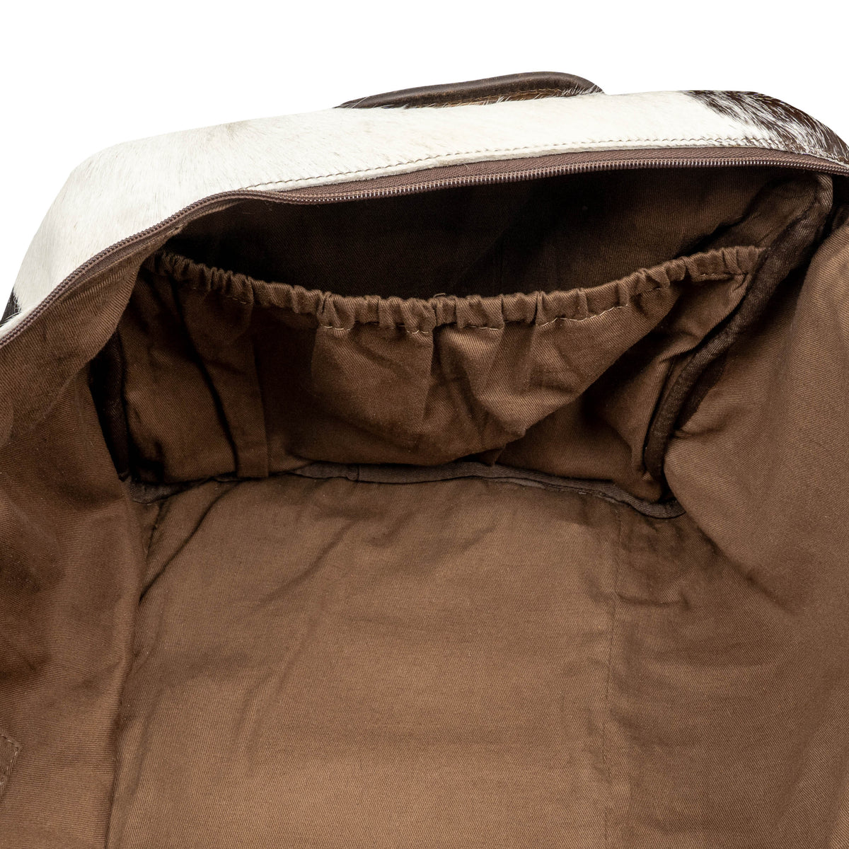 Cowhide Rustler Duffle bag by STS Ranchwear with rugged leather and durable handles, designed for travel and outdoor use.