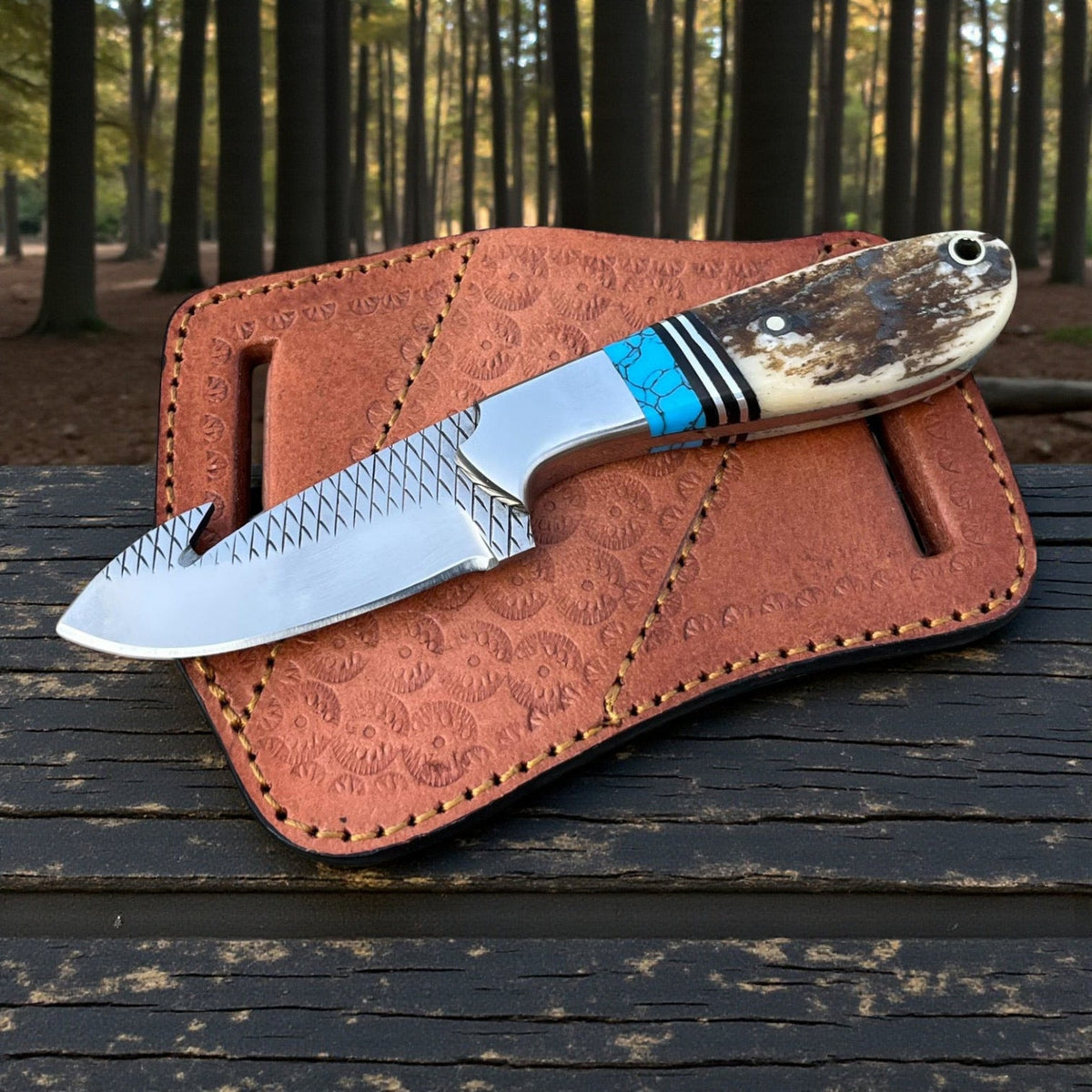 Malika Knives D2 Steel Cowboy Gut Hook Knife with 5mm thick blade and pancake sheath, showcasing its simple design and sharp edge.