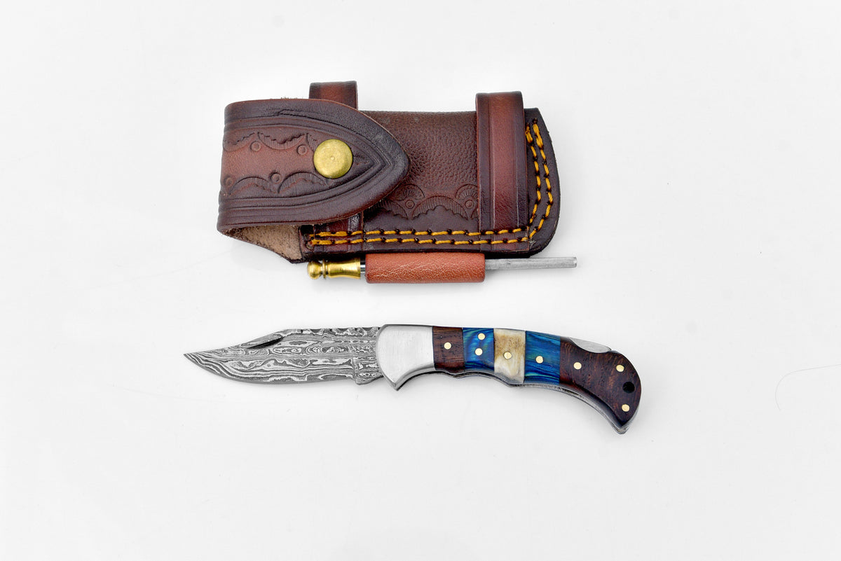Damascus steel pocket knife by Titan International K with a patterned blade and wooden handle, limited run TF-071.