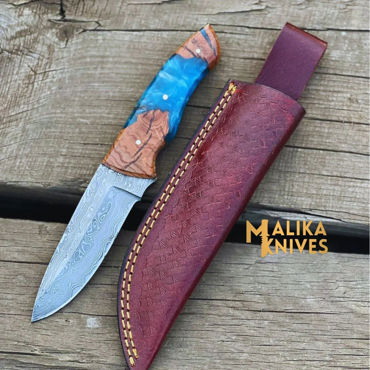 Malika Knives handmade Damascus steel skinner knife with rosewood and resin handle, leather sheath, ideal for outdoor use.