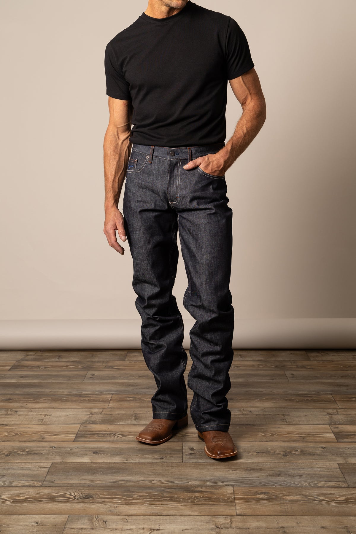 Dark wash Kimes Ranch Men's Raw Dillon Jeans with classic fit and rugged denim texture, designed for a stylish, comfortable look.