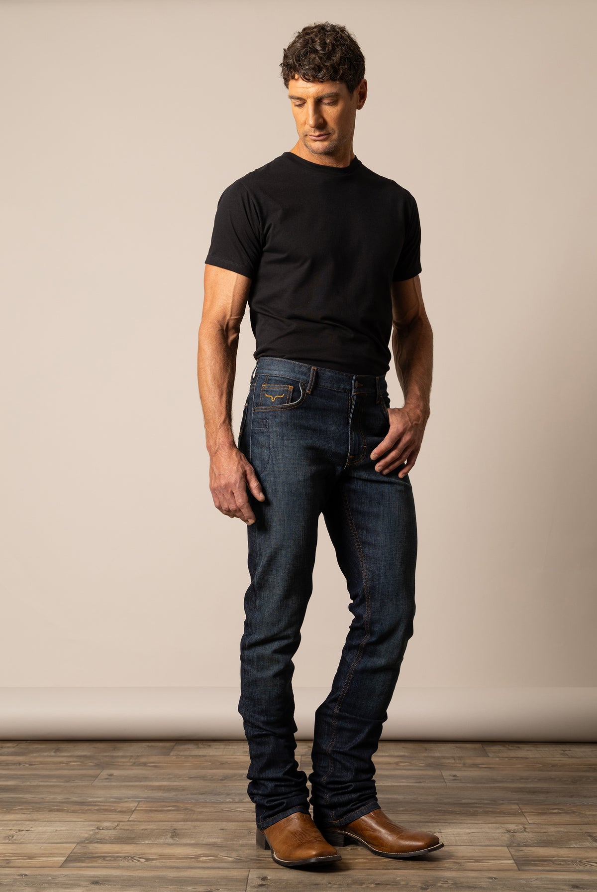 Dark wash Kimes Ranch men's Roger jeans with classic fit and five-pocket design, displayed on a neutral background.