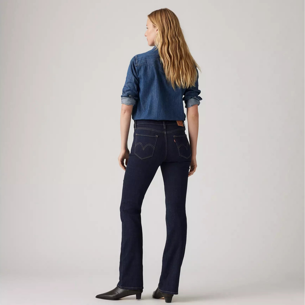 Levi's® Women's Classic Bootcut Jeans in dark wash, fitted with a mid-rise waist and traditional five-pocket styling.