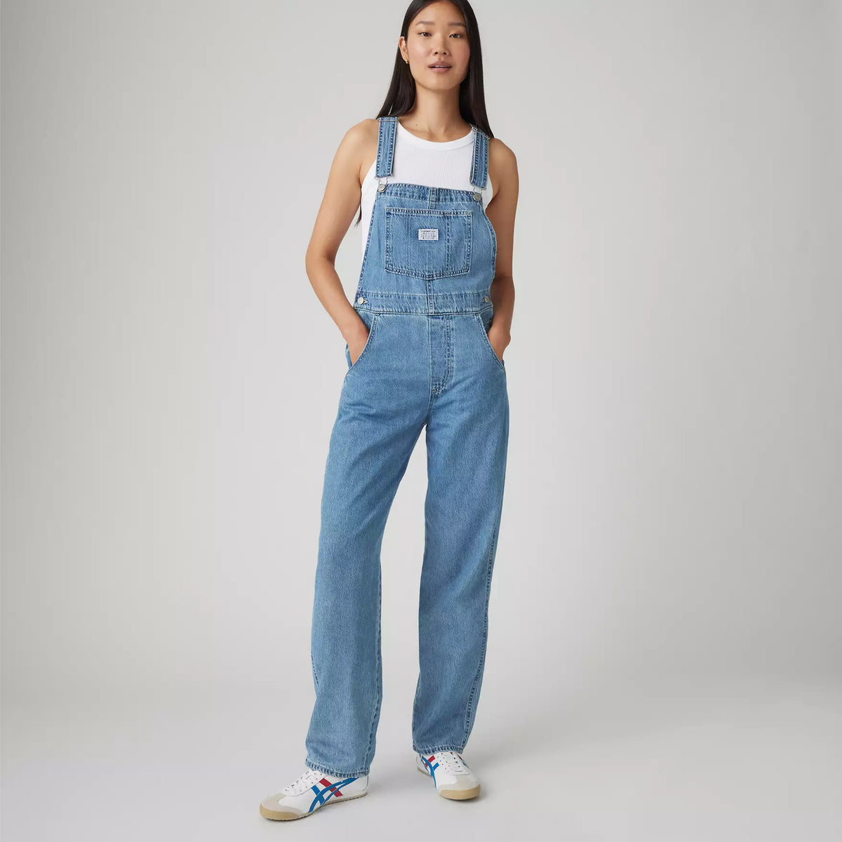 Levi's Women's Vintage Denim Overalls in medium wash, featuring classic straps, front pockets, and relaxed fit.
