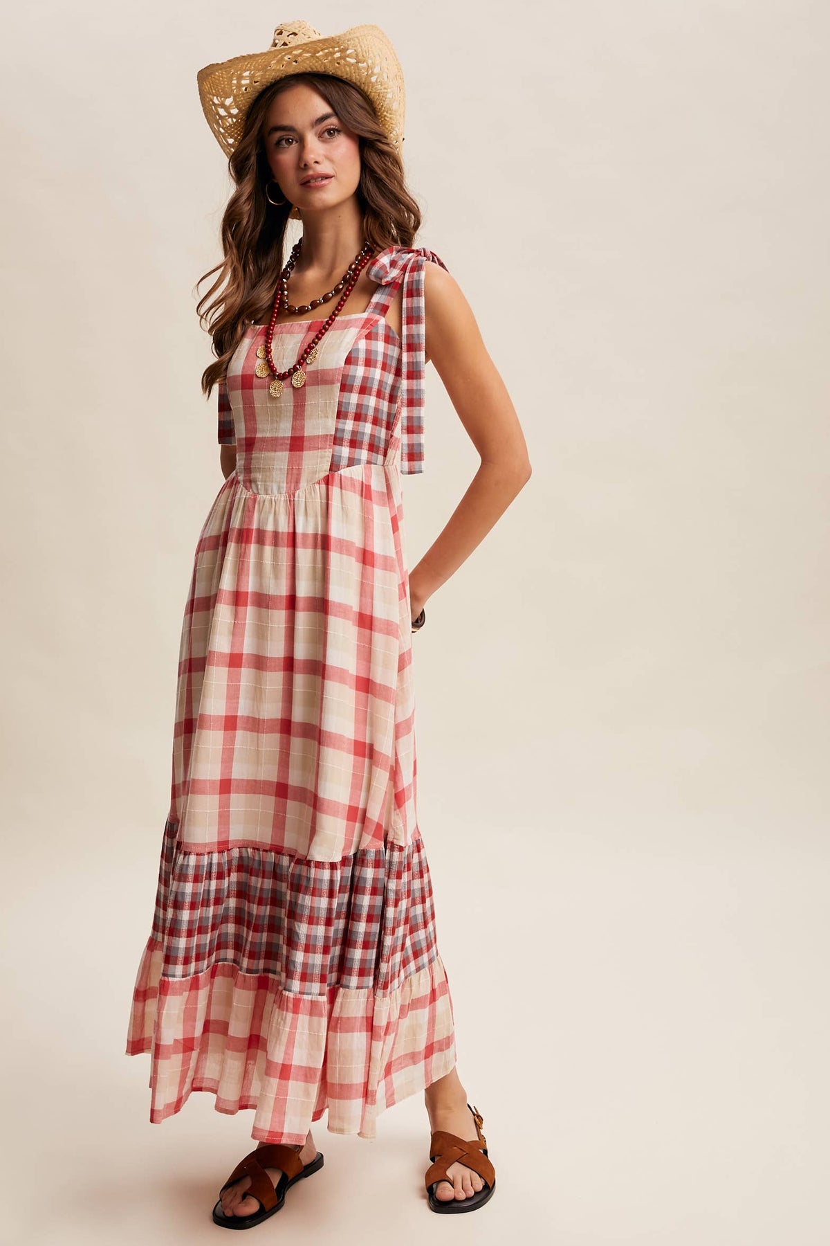 Gingham tiered maxi dress by Listicle featuring a flowy silhouette and adjustable straps, perfect for casual summer wear.