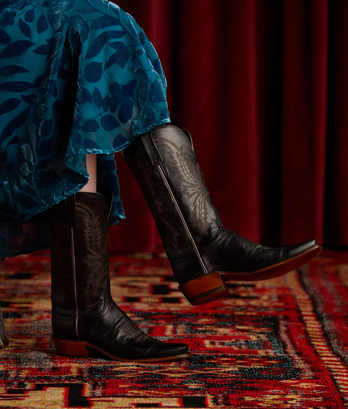 Black Lucchese Women's Savannah boots featuring sleek leather design and detailed stitching, stylish Western ankle boots.
