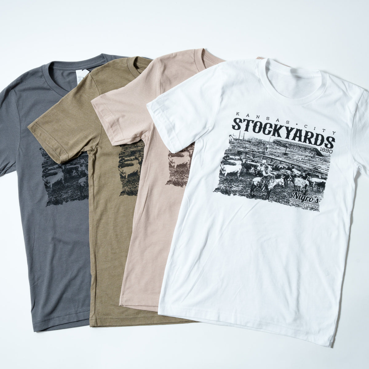 Nigro's Western Store Kansas City Stockyards T-Shirt – four colors flat lay