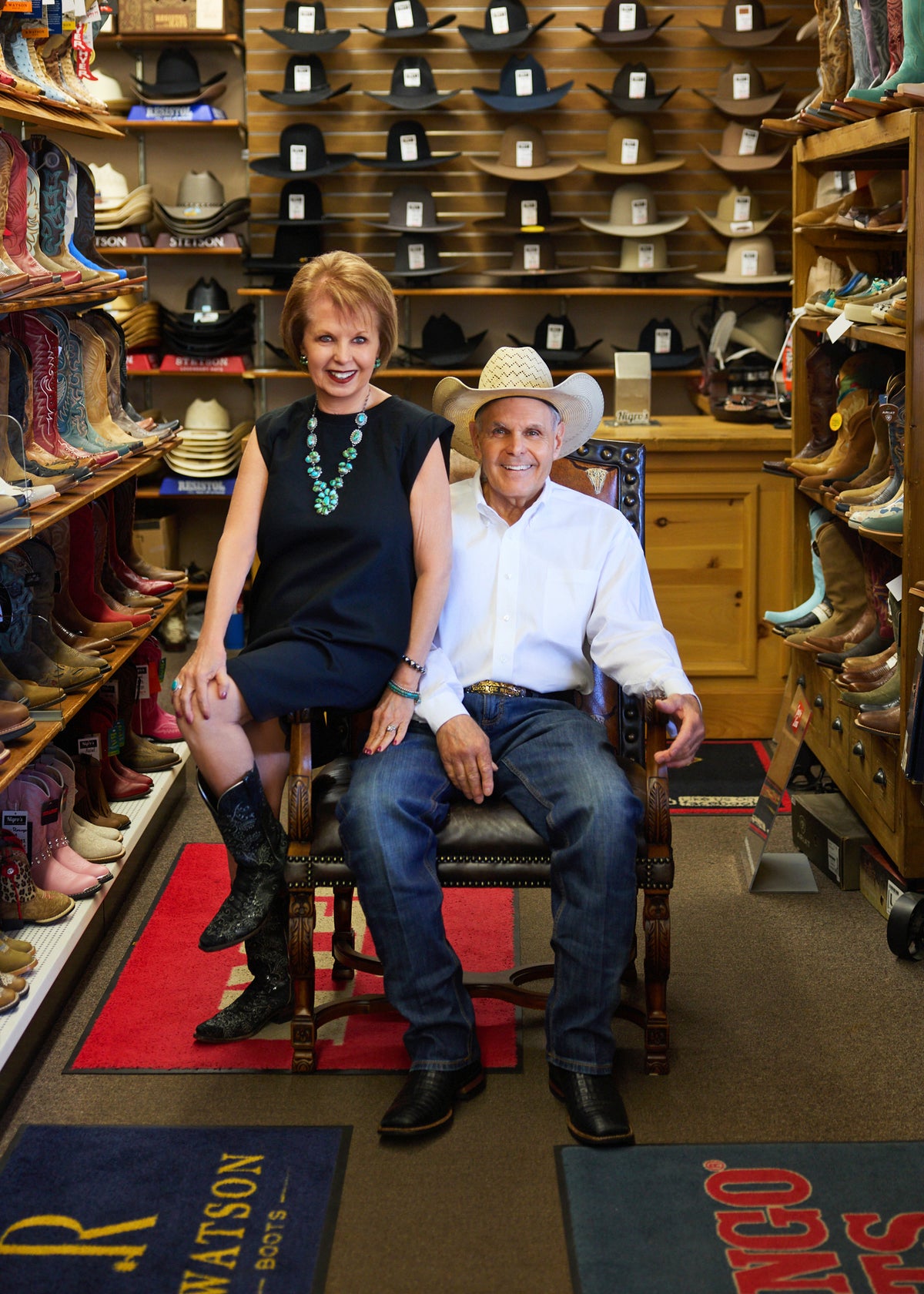 George and Patty Nigro sitting in the store's boot aisle