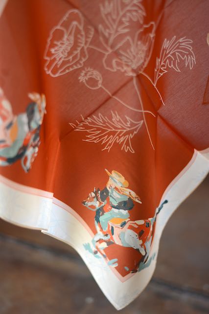 Tirzah Lane Art Poppy Cowgirl Western scarf bandana made of silk and Tencel with a cowgirl and poppy floral design.