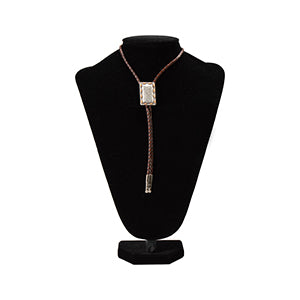Rectangular bolo tie with buck-lace edging and braided cord, western style.