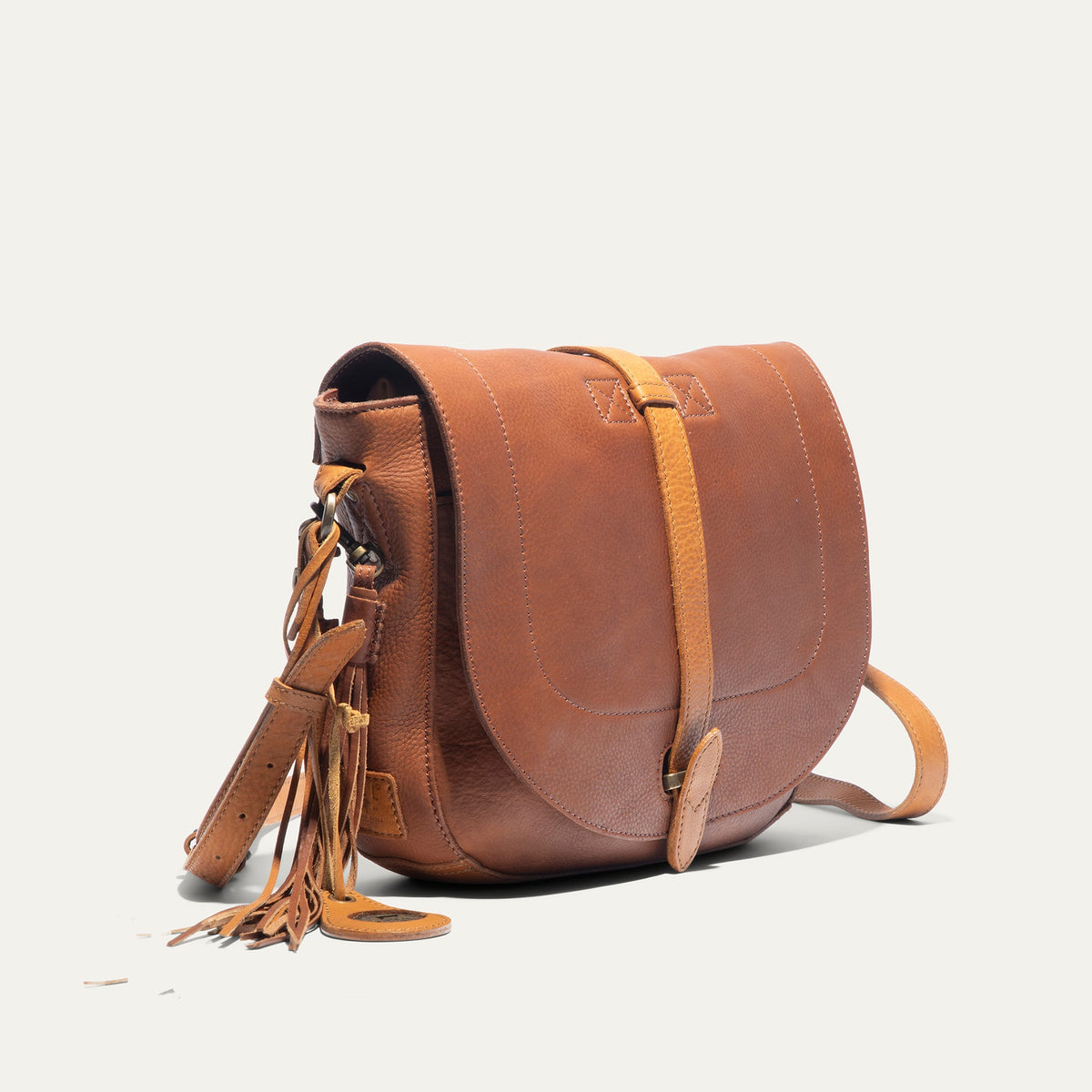 Will Leather Goods Seneca Leather Crossbody bag in caramel with adjustable strap and minimalist design, showcasing craftsmanship.