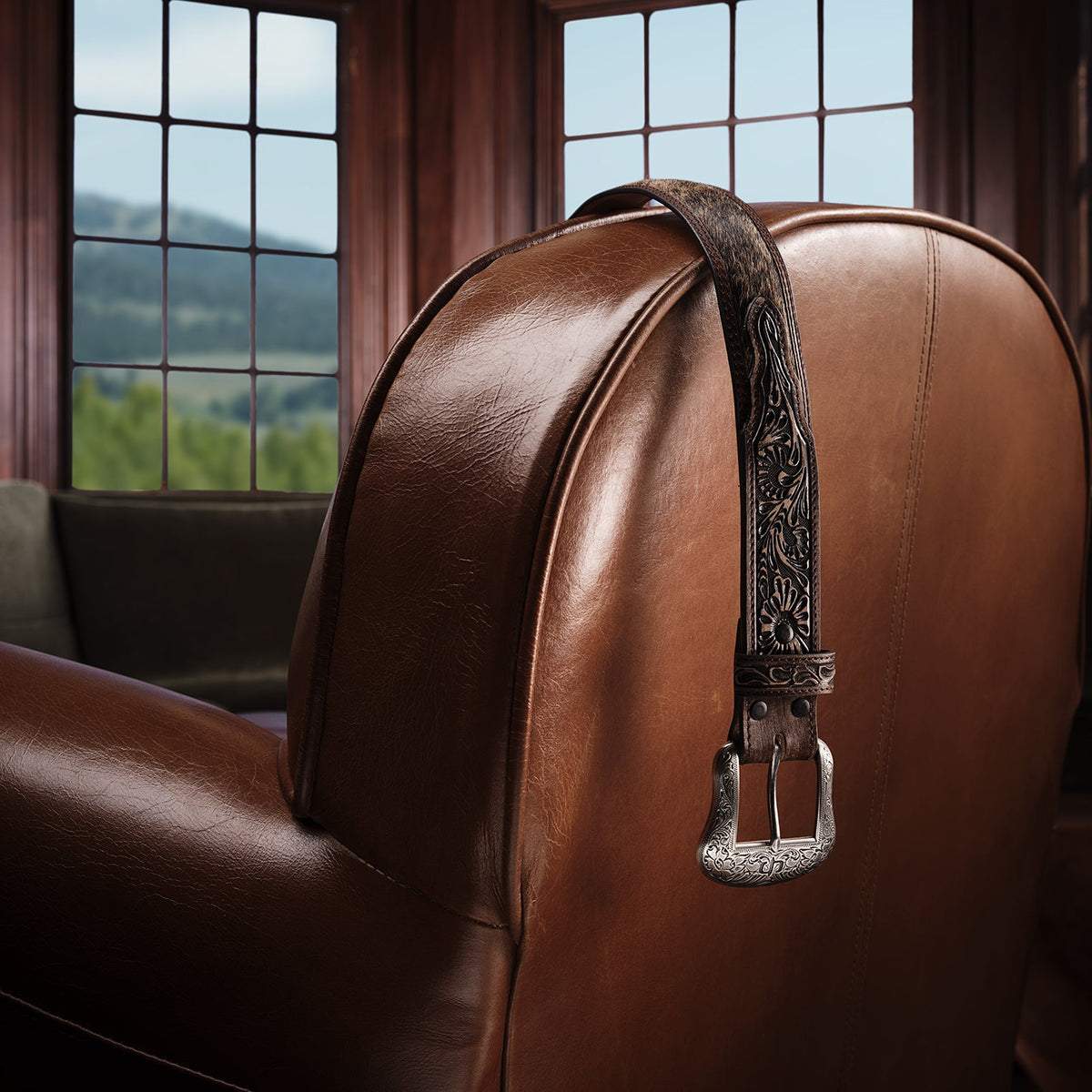 Brown vintage Stetson Hair-on-Hide Tooled Tab Belt with detailed leather tooling and a classic buckle design.