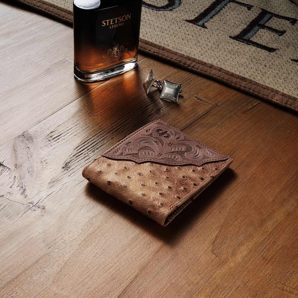 Stetson tooled embossed ostrich leather bi-fold wallet by Gem Dandy, showcasing intricate tooling and textured ostrich skin details.