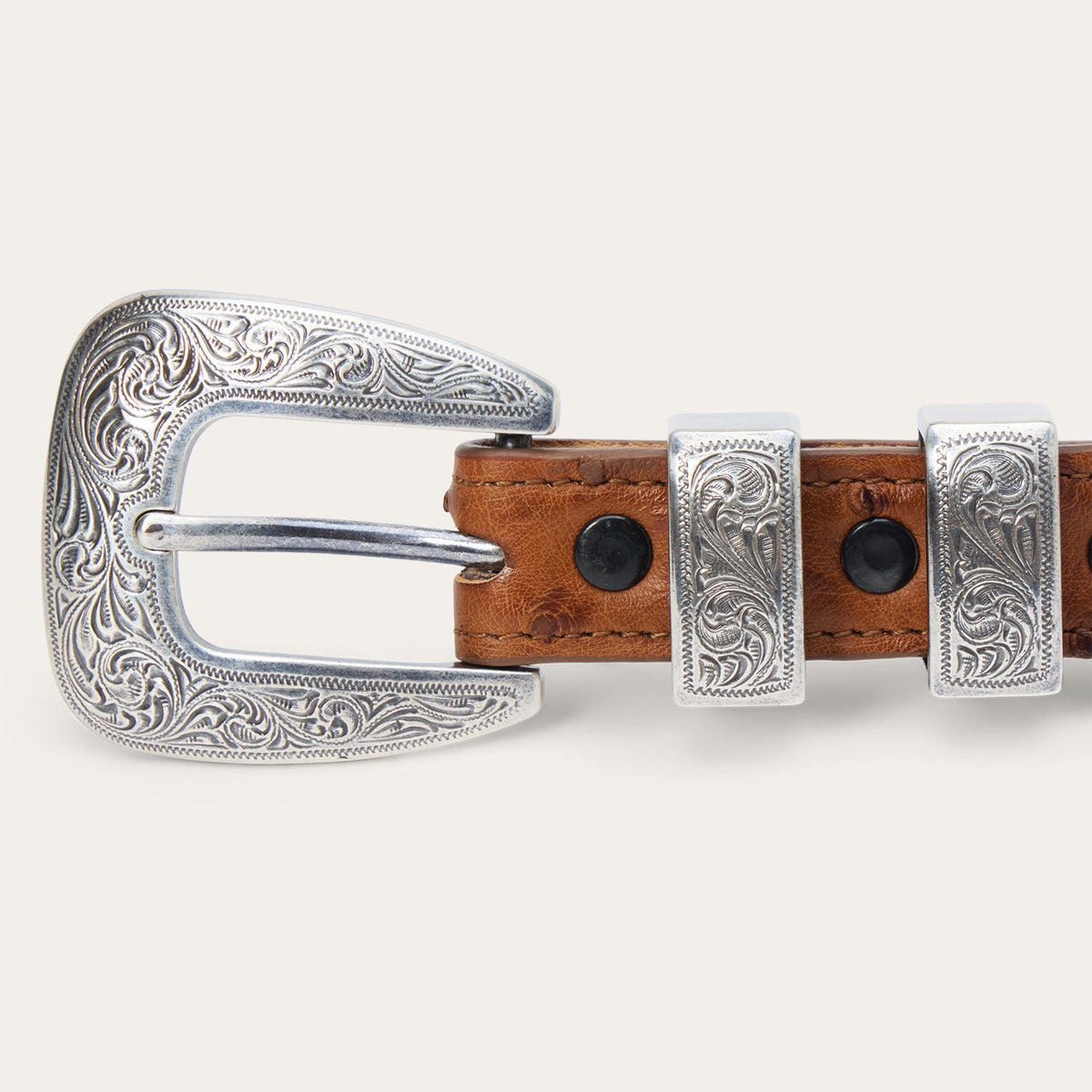 Stetson Women's Ostrich Tapered Tab Belt in antique cognac leather, featuring a tapered design and metal buckle.