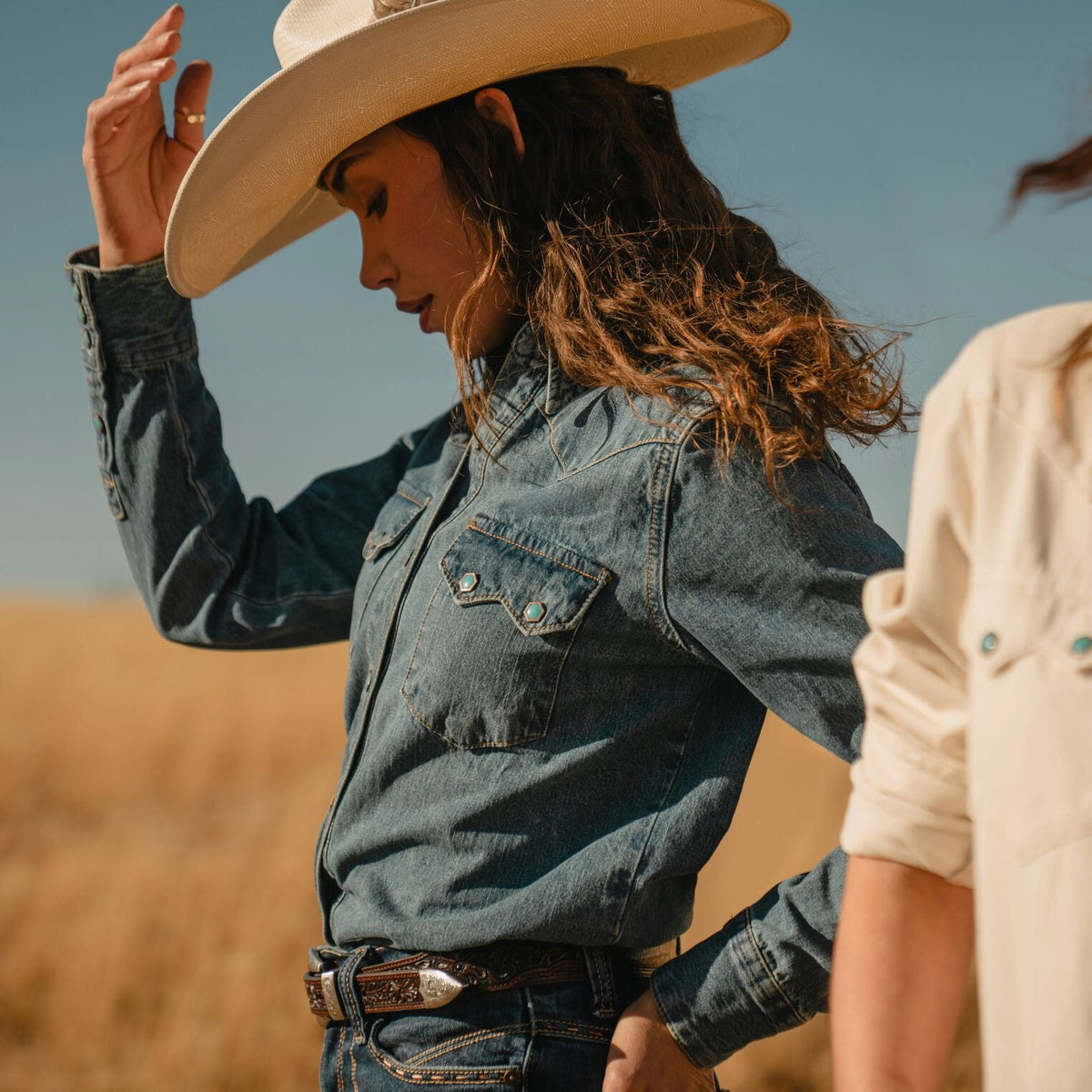 Stetson turquoise snap western denim shirt with button closures and classic Western styling, displayed on a hanger.