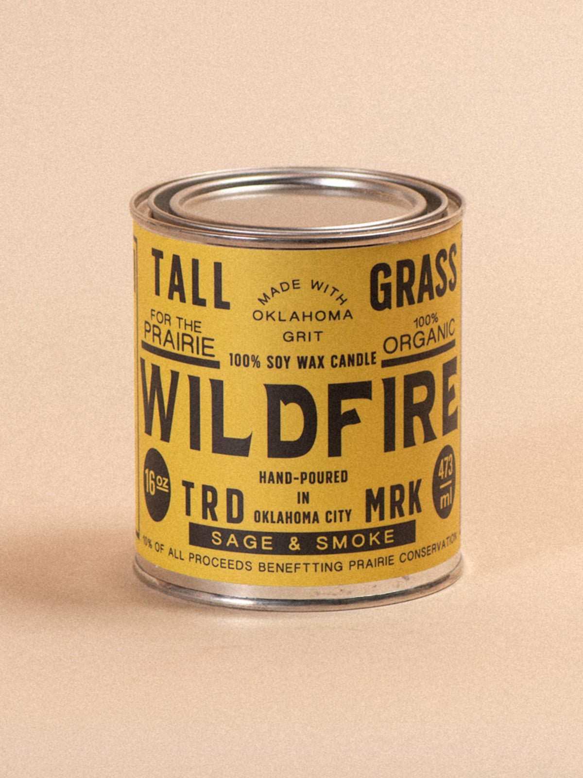 Tallgrass Supply Wildfire soy wax candle with sage and smoke scent, featuring a tall, elegant candle design.
