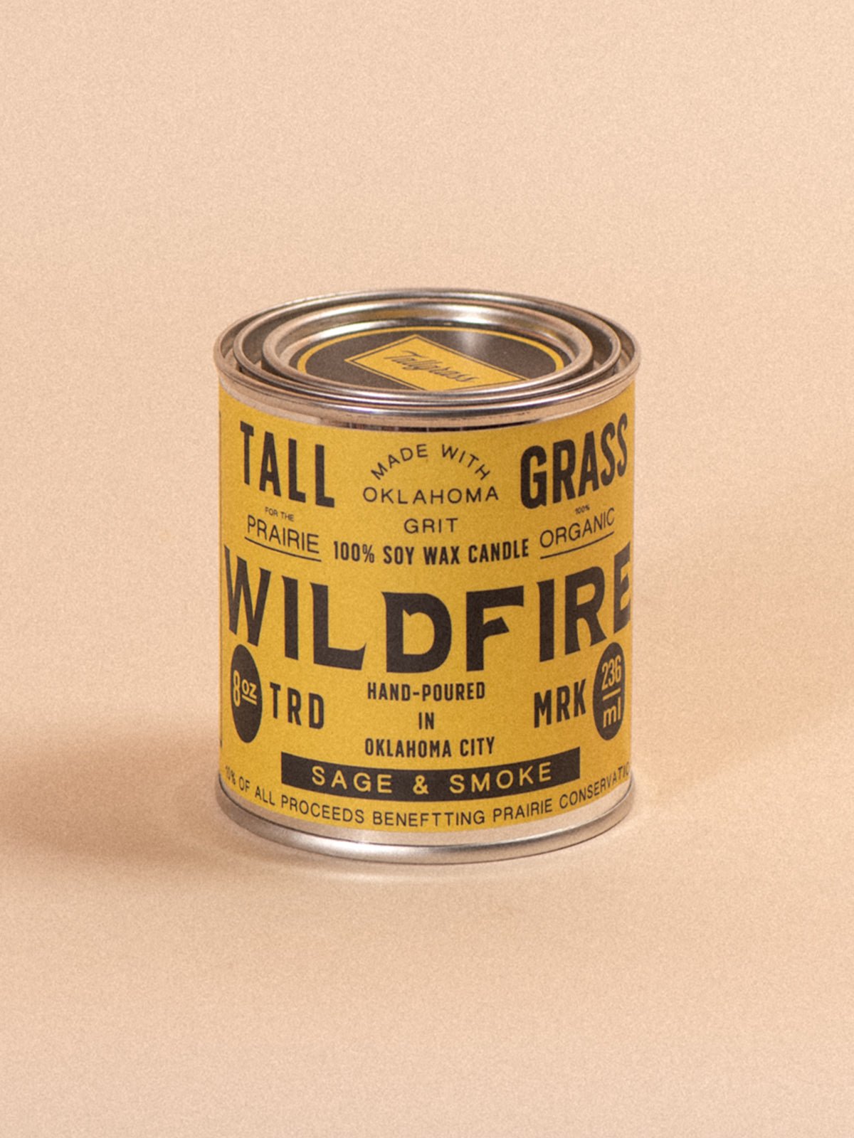 Tallgrass Supply Wildfire soy wax candle with sage and smoke scent, featuring a tall, elegant candle design.