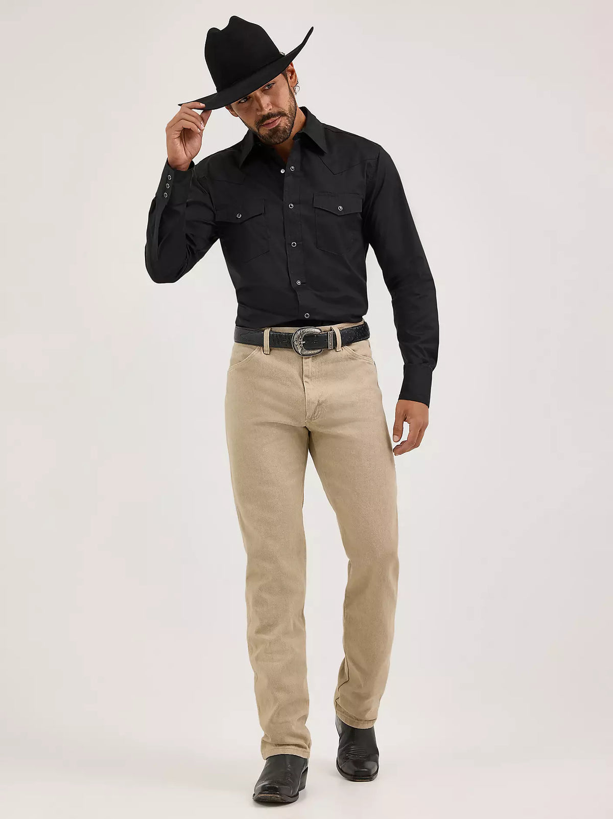 Wrangler Men's Cowboy Cut Original Fit jeans in prewashed tan denim, featuring classic Western styling and durable construction.