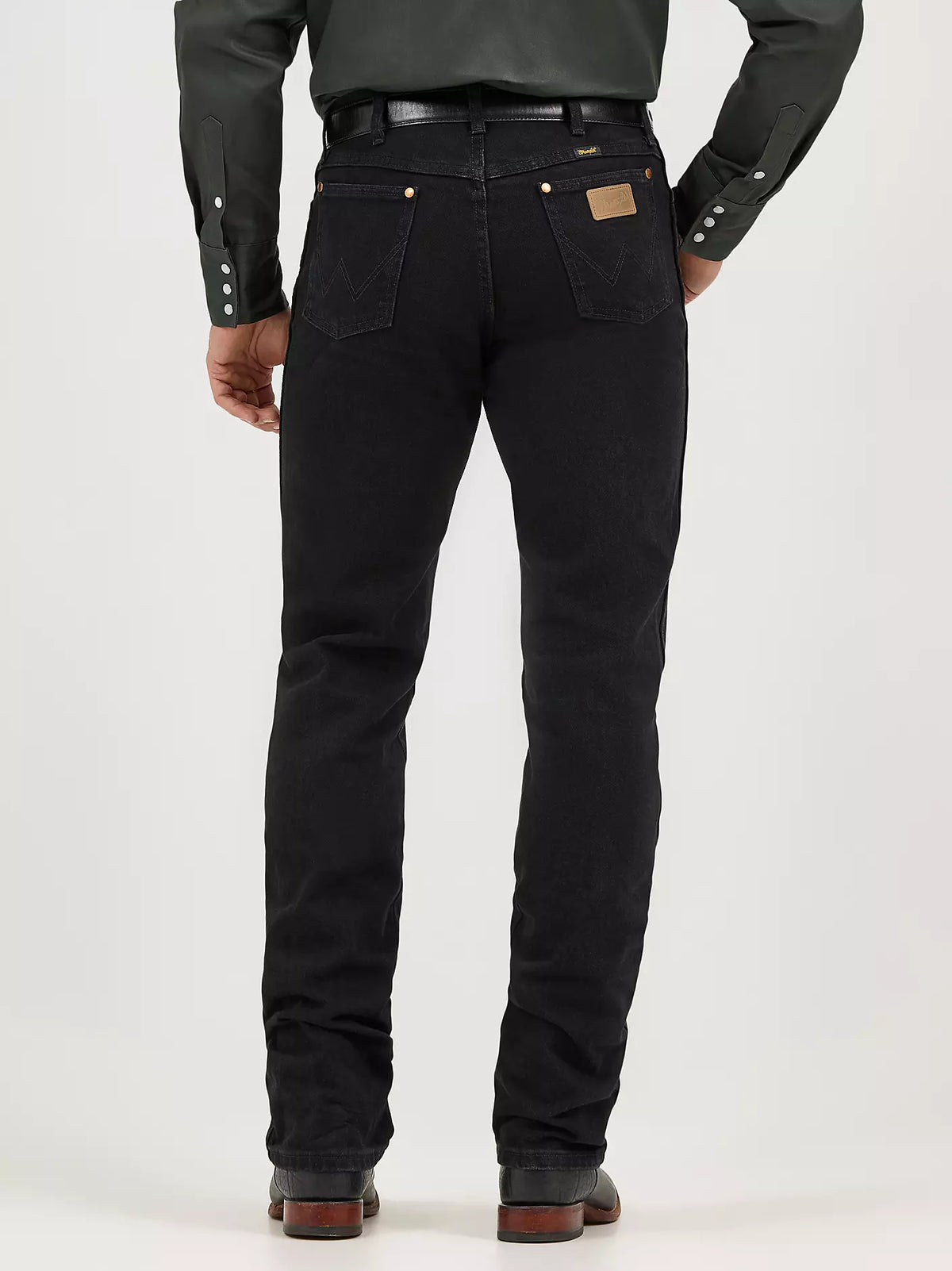 Wrangler Men's Cowboy Cut Original Fit jeans in Shadow Black, showing the classic five-pocket design and sturdy denim fabric.