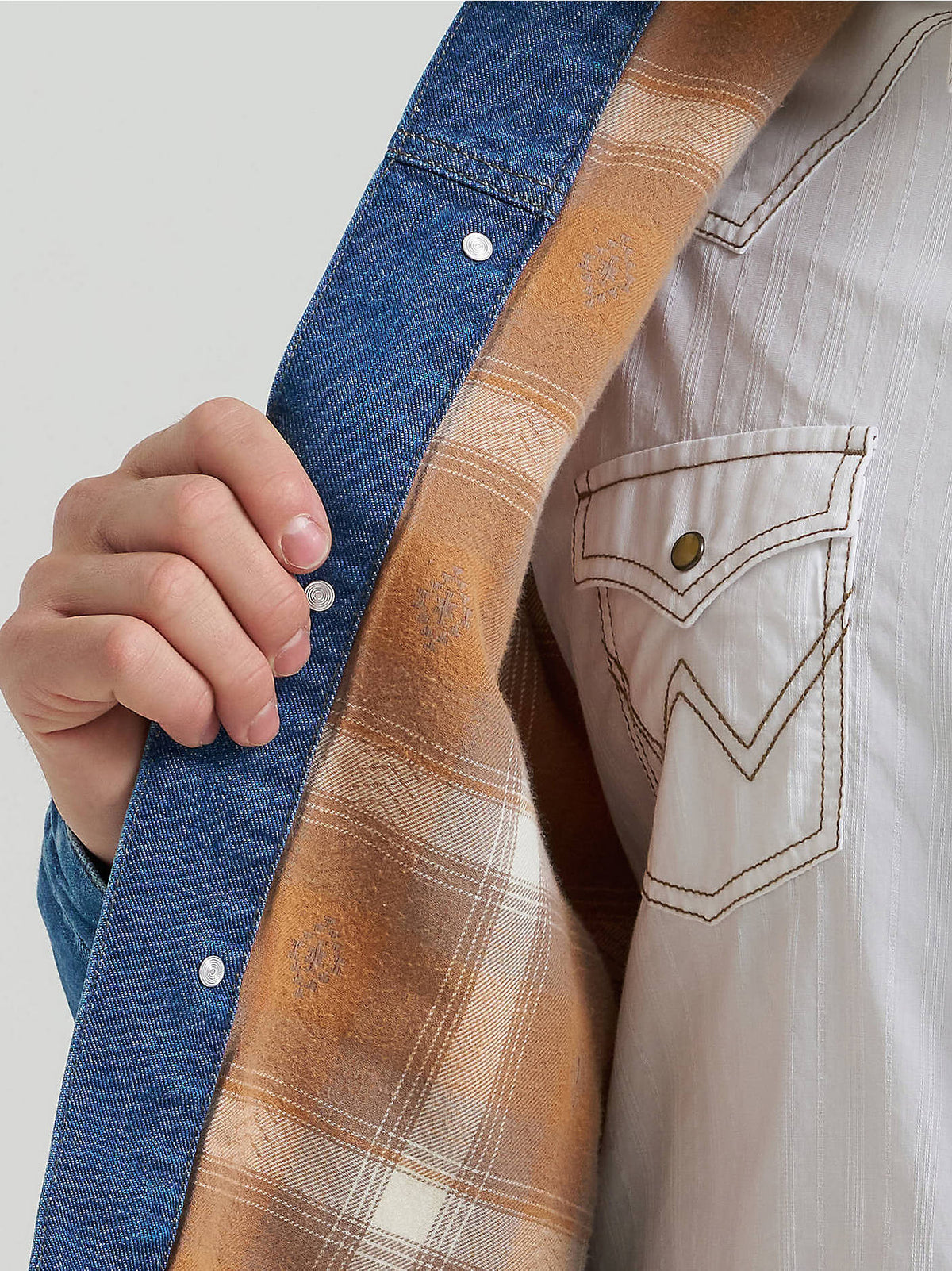 Front view of the Wrangler® Cowboy Cut Flannel Lined Denim Jacket in Blue Indigo, showing button front, spread collar and W-stitched chest pockets.