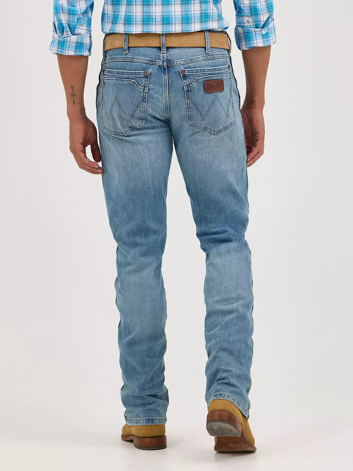 Wrangler Men's Retro Slim Straight Jacksboro jeans in denim, showing front view with classic five-pocket design and tapered fit.
