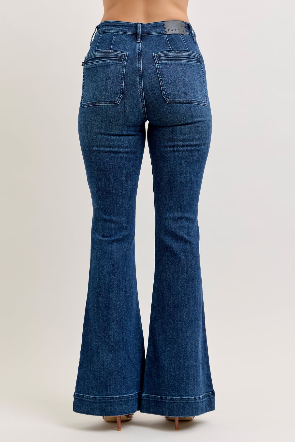 Judy Blue high waist pintuck flare jean in dark wash, close view of the dark denim