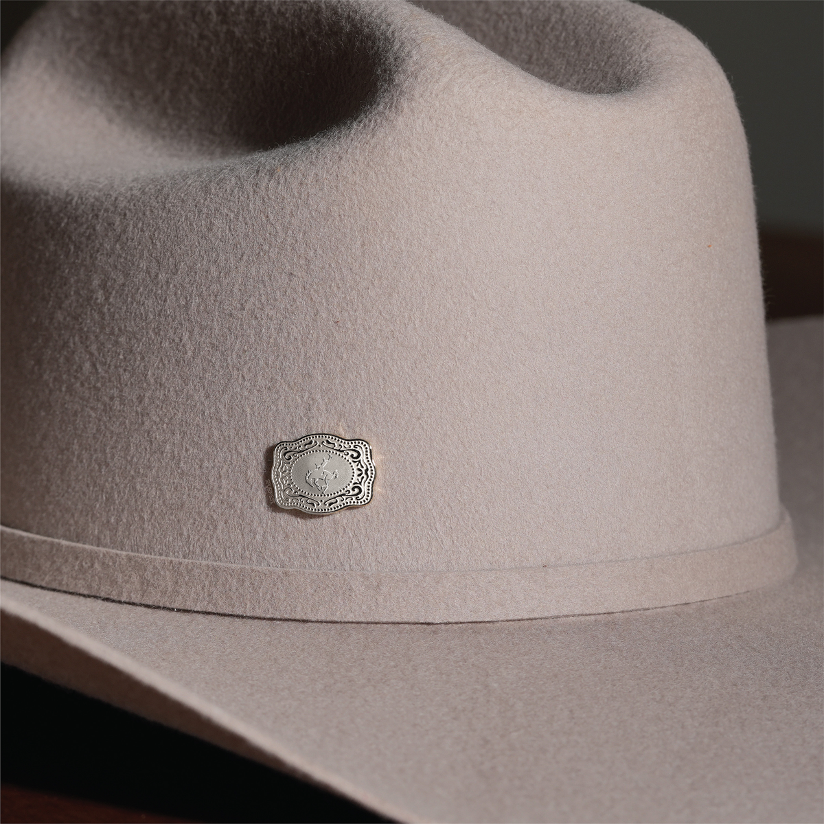SpurWest Bronc hatpin shown on a felt cowboy hat
