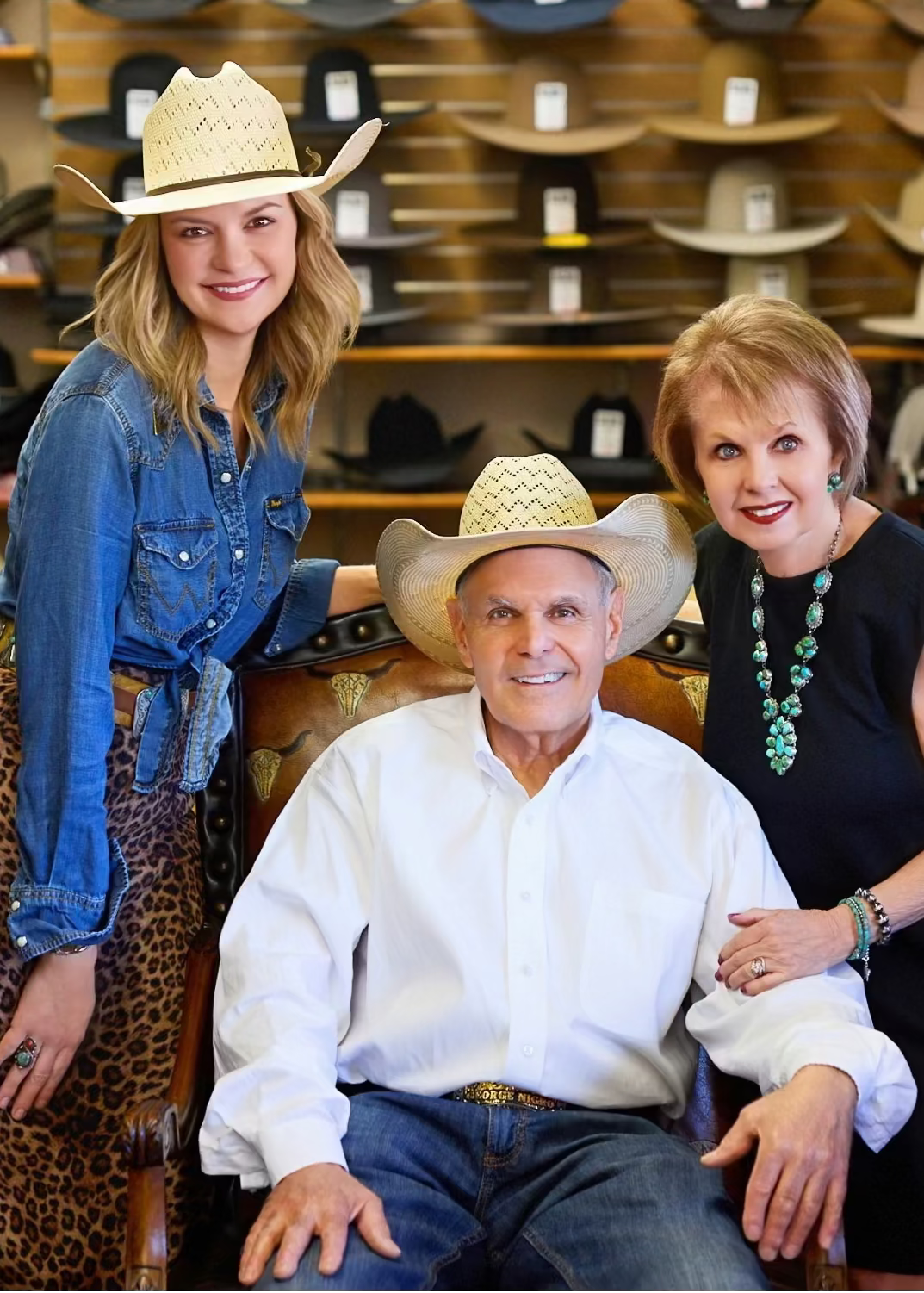 Katie with her parents, George and Patty, in the store