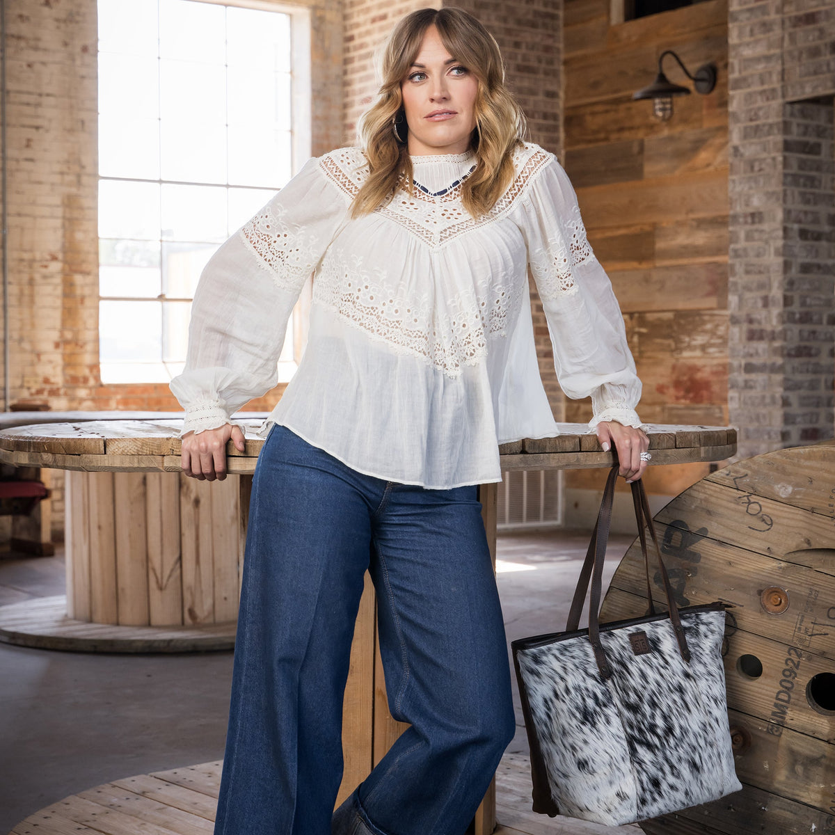 STS Ranchwear Women's Cowhide Laptop Tote – lifestyle on model