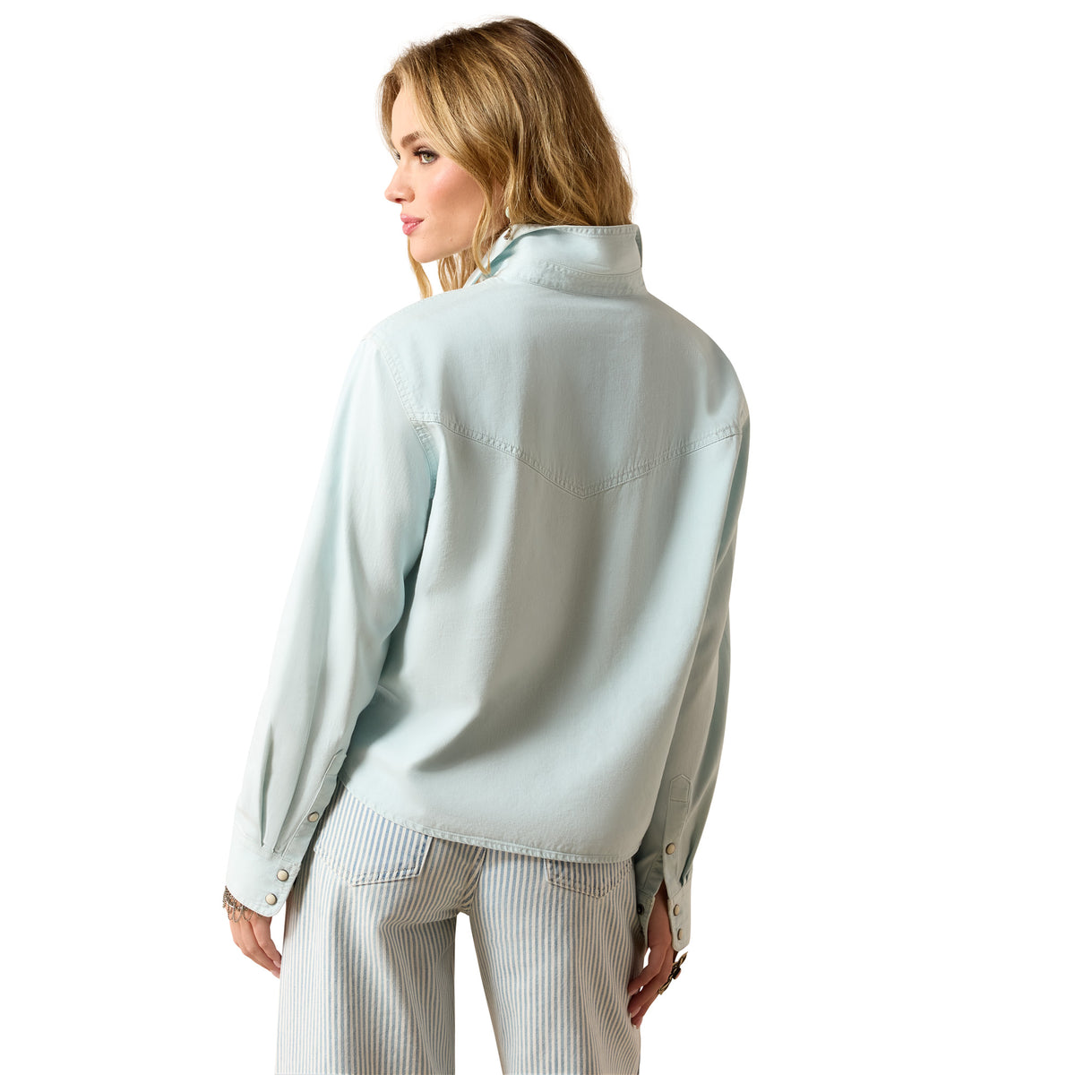 Ariat Women's Asheville Snap Shirt in light wash indigo denim, featuring snap buttons and a classic casual fit.